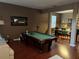 This is a shot of the game room featuring a pool table and open access to the dining room at 13252 Vennetta Way, Windermere, FL 34786