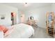 Bright bedroom showcasing neutral colors, closet and desk area at 13993 Title Way, Winter Garden, FL 34787