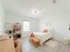Cozy bedroom with a cute decor and a well-lit window at 13993 Title Way, Winter Garden, FL 34787
