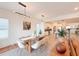 Bright dining area featuring modern lighting, table with seating for six and kitchen view at 13993 Title Way, Winter Garden, FL 34787