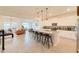 Spacious open kitchen with a large island, bar seating, and seamless integration with the living spaces at 13993 Title Way, Winter Garden, FL 34787