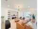 Inviting living room features a fireplace, built-in shelves and natural light from the windows at 13993 Title Way, Winter Garden, FL 34787