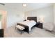 Relaxing main bedroom with a neutral color scheme, bench seating, and soft, natural light at 13993 Title Way, Winter Garden, FL 34787
