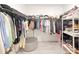Spacious walk-in closet features ample shelving, hanging space, and modern design at 13993 Title Way, Winter Garden, FL 34787