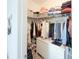 Organized walk-in closet with shelves, hanging racks, and drawers at 13993 Title Way, Winter Garden, FL 34787