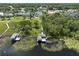 Aerial view featuring backyard docks and waterfront views at 1741 Edgewater Dr, Mount Dora, FL 32757