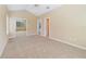 Well-lit bedroom offering ample space, neutral colors, and sliding closet doors at 1741 Edgewater Dr, Mount Dora, FL 32757