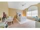 Bright bedroom featuring vaulted ceiling, plush carpet, and a large window at 1741 Edgewater Dr, Mount Dora, FL 32757