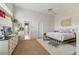 Spacious bedroom with a comfy bed, bright natural light, and neutral decor at 1741 Edgewater Dr, Mount Dora, FL 32757