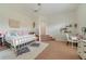 Bright bedroom with a comfortable bed, ceiling fan, and ample space for relaxation at 1741 Edgewater Dr, Mount Dora, FL 32757