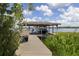 Exterior shot of boat dock with boat lift and walkway at 1741 Edgewater Dr, Mount Dora, FL 32757