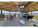 Boat dock with boat lift, covered area, table, chairs, and lake views at 1741 Edgewater Dr, Mount Dora, FL 32757