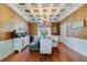 Dining room with coffered ceilings, light fixtures, and wood floors at 1741 Edgewater Dr, Mount Dora, FL 32757