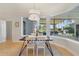 Bright dining area with views of outdoor patio and pool at 1741 Edgewater Dr, Mount Dora, FL 32757