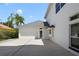 Exterior view of a home featuring a two-car garage and neutral paint at 1741 Edgewater Dr, Mount Dora, FL 32757