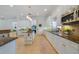 Spacious kitchen features white cabinets, stainless steel appliances, and granite countertops at 1741 Edgewater Dr, Mount Dora, FL 32757