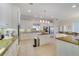 Bright kitchen featuring white cabinets, stainless appliances, and a center island at 1741 Edgewater Dr, Mount Dora, FL 32757