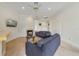 Cozy living room featuring a fireplace, sofas, and a television at 1741 Edgewater Dr, Mount Dora, FL 32757