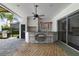Covered outdoor bar area with seating, modern appliances, and a view of the backyard at 1741 Edgewater Dr, Mount Dora, FL 32757