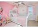 Inviting bedroom showcases a plush bed, soft pink accents, and plenty of natural light at 1785 Red Canyon Dr, Kissimmee, FL 34744