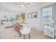 Inviting dining area featuring modern table with chairs and bench, seamlessly connecting to living spaces at 1785 Red Canyon Dr, Kissimmee, FL 34744