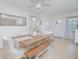 Charming dining room area featuring farmhouse table with chairs and bench, perfect for Gathering meals at 1785 Red Canyon Dr, Kissimmee, FL 34744