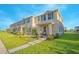 Beautifully landscaped townhome with a welcoming porch, offering great curb appeal in a friendly neighborhood at 1785 Red Canyon Dr, Kissimmee, FL 34744