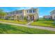 Charming townhome showcasing lush green lawn and well-maintained landscaping in a desirable community at 1785 Red Canyon Dr, Kissimmee, FL 34744