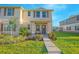 Inviting townhome with manicured lawn and charming front porch, perfect for enjoying the outdoors at 1785 Red Canyon Dr, Kissimmee, FL 34744
