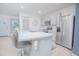 Modern kitchen featuring stainless steel appliances, countertop seating, and ample cabinet space at 1785 Red Canyon Dr, Kissimmee, FL 34744