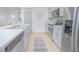 Updated kitchen boasts stainless steel appliances, light gray cabinets, and a lovely tile floor at 1785 Red Canyon Dr, Kissimmee, FL 34744