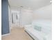 Cozy living room with a white sofa, carpeted floors, and neutral walls at 1785 Red Canyon Dr, Kissimmee, FL 34744