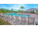 Beautiful community pool and clubhouse with lounge chairs and tables for relaxing and enjoying the Florida sunshine at 1785 Red Canyon Dr, Kissimmee, FL 34744
