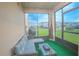Relaxing screened porch with comfortable seating and a view of the landscaped yard at 1785 Red Canyon Dr, Kissimmee, FL 34744
