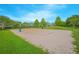 Well-maintained sand volleyball court surrounded by green space, perfect for outdoor recreation and community fun at 1785 Red Canyon Dr, Kissimmee, FL 34744