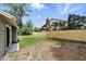 A spacious backyard featuring a wood fence at 1850 North St, Longwood, FL 32750
