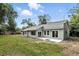 Spacious backyard featuring sliding glass doors that provides access to the home at 1850 North St, Longwood, FL 32750