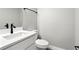This bathroom features modern fixtures, white cabinets, and a toilet at 1850 North St, Longwood, FL 32750