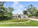 Charming single-story home with a well-manicured lawn and inviting curb appeal at 1850 North St, Longwood, FL 32750