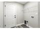 This laundry room includes ample storage space and modern design at 1850 North St, Longwood, FL 32750