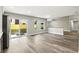 Living room boasts hardwood floors, sliding glass doors, and an open floor plan at 1850 North St, Longwood, FL 32750