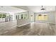 Open-concept kitchen and living area with modern floors and plenty of natural light at 1850 North St, Longwood, FL 32750