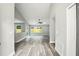 A bright open-concept living area features sleek flooring and neutral paint at 1850 North St, Longwood, FL 32750