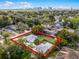 Property outlined in red showing a well-maintained yard, detached garage, and neighborhood setting with city view at 1911 Canton St, Orlando, FL 32803