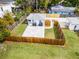 Aerial view of a home with a fenced backyard and large paver patio, perfect for outdoor living at 1911 Canton St, Orlando, FL 32803
