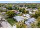 Overhead view of a lovely home featuring a lush backyard, quaint outdoor shed, and private driveway at 1911 Canton St, Orlando, FL 32803