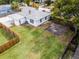 Aerial view of a home featuring a large backyard and wooden fencing on a sunny day at 1911 Canton St, Orlando, FL 32803