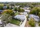 Charming single-Gathering home with a well-manicured front lawn and a long driveway, surrounded by lush trees at 1911 Canton St, Orlando, FL 32803