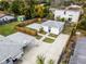 Aerial view of fenced yard with patio and easy access to driveway and detached garage at 1911 Canton St, Orlando, FL 32803