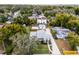 Charming single-Gathering home with a well-manicured front lawn and a long driveway, surrounded by lush trees at 1911 Canton St, Orlando, FL 32803